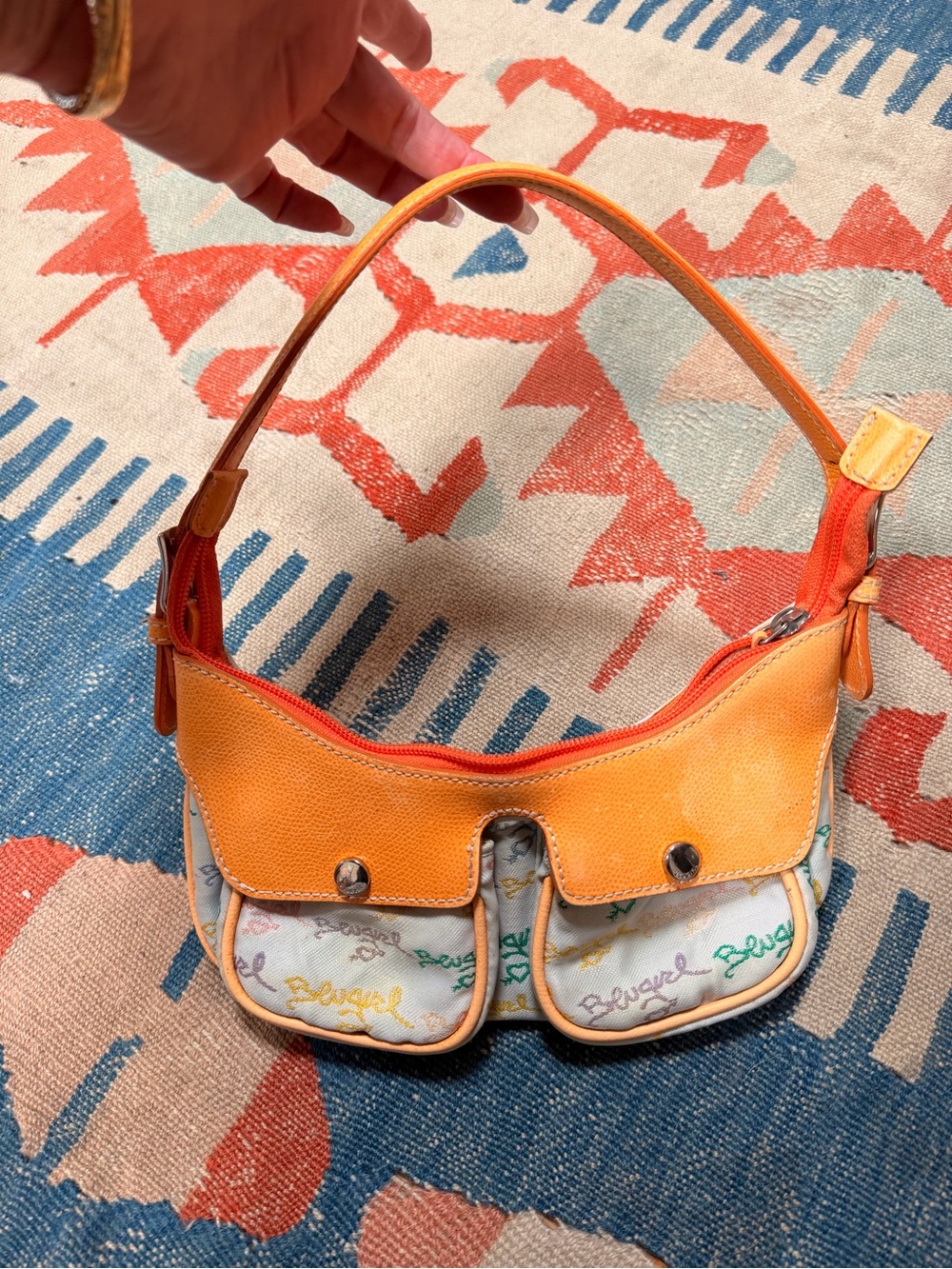 Blumarine Blugirl Y2K Vintage mini bag
Multicolor logo with orange leather trim